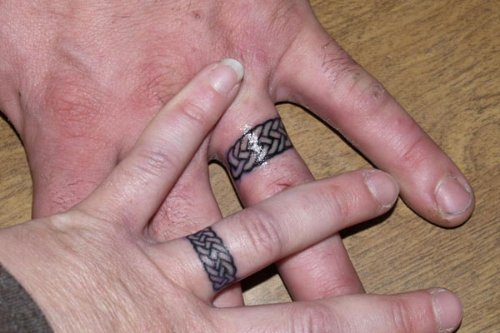 Glowing Celtic Knot Tattoo On Fingers