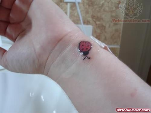 Ladybug Tattoo on Ankle
