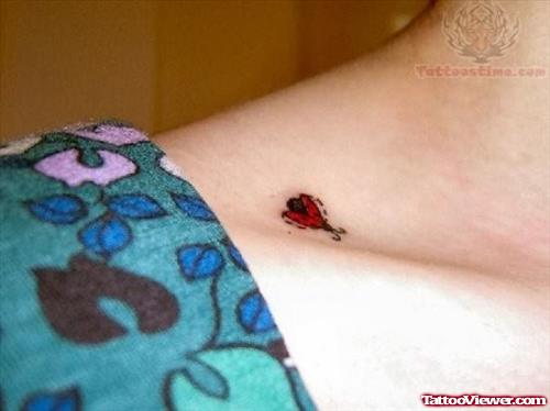 Little Ladybug Tattoo On Neck