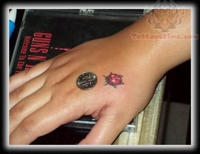 Ladybug Hand Tattoo