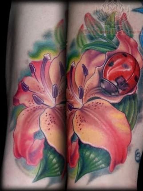 Ladybug Sitting On Flowers Tattoo