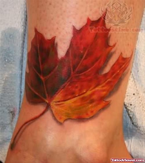 Orange Leaf Fall Tattoo On Ankle