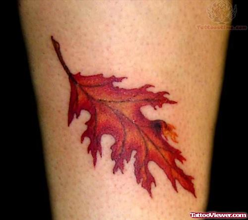 Orange Leaf Tattoo On Ankle