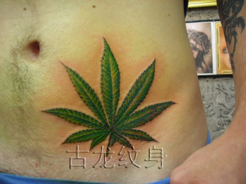 Green Marijuana Leaf Tattoo On Left Hip