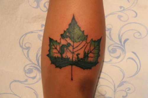 Amazing Green Maple Leaf Tattoo On Leg