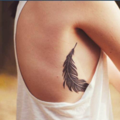 Grey Ink Leaf Tattoo On Girl Side Rib