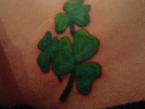 Green Shamrock Leaf Tattoo On Lowrback