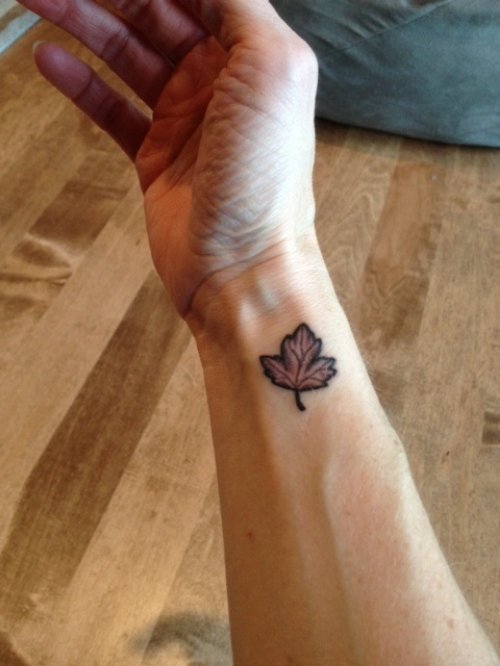 Grey Ink Leaf Tattoo On Right Wrist