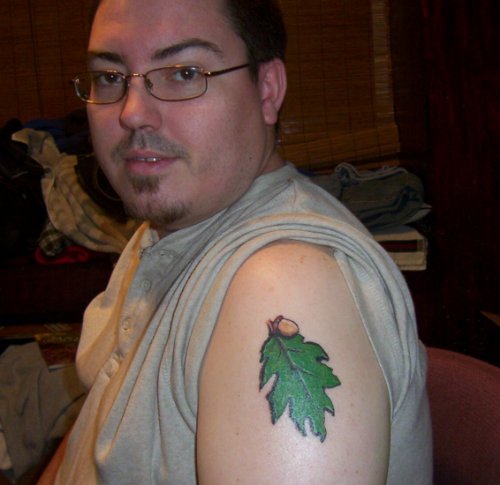 Green Ink Oak Leaf Tattoo On Left Shoulder