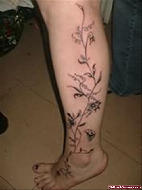 Vine Flowers left Leg Tattoo