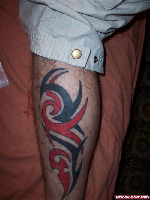 Red And Black Tribal Leg Tattoo