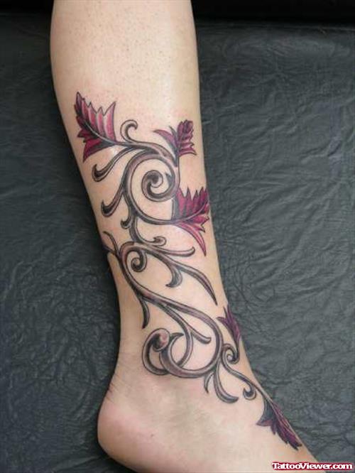 Awesome Tribal And Flowers Leg Tattoo