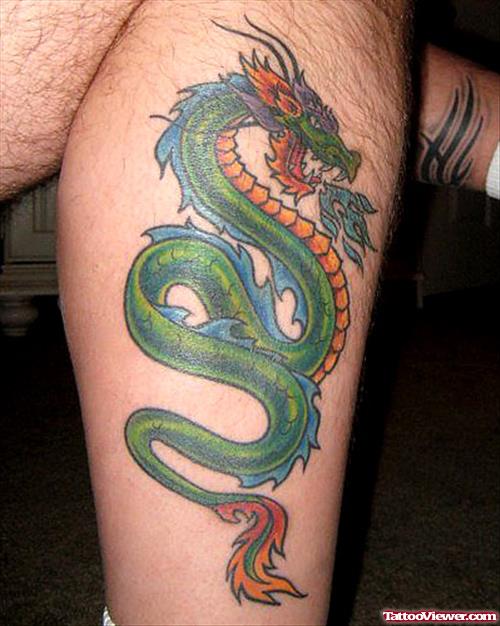 Green Ink Leg Tattoo On Leg