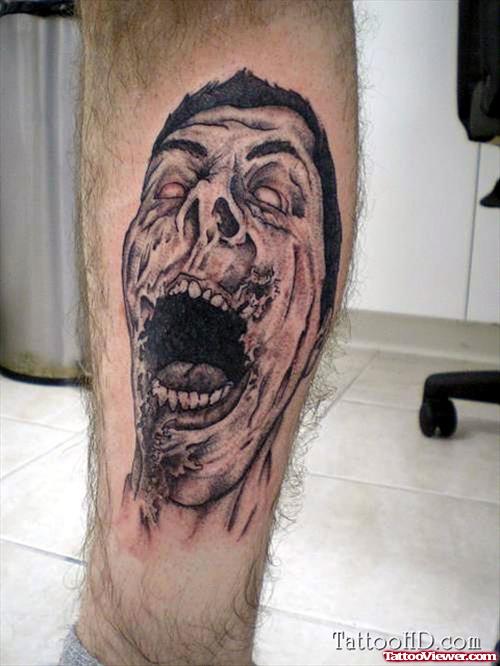 Grey Ink Zombie Face Leg Tattoo