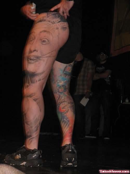 Big Face Tattoo On Thigh and Leg