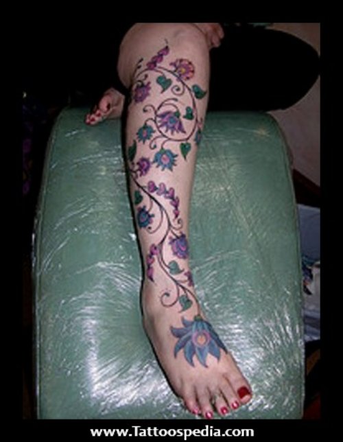 Colored Flowers Leg Tattoo For Girls