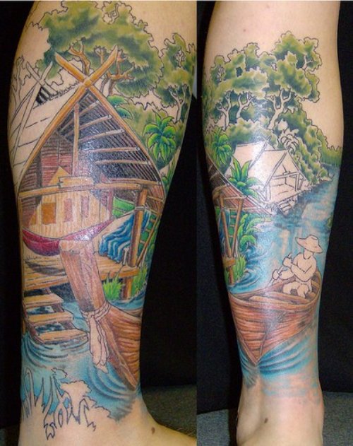 Beautiful Colored House Near River And Boat Leg Tattoo