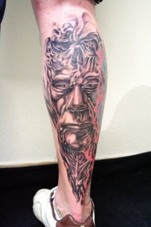 Grey Ink Scary Back Leg Tattoo