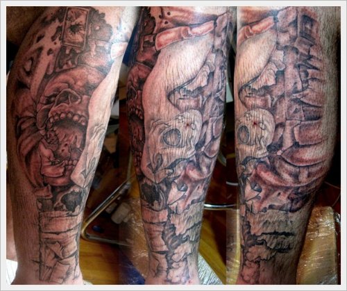 Grey Ink Skull And Ripped Skin Leg Tattoo