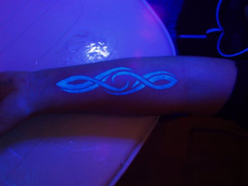 Tribal Light Tattoo On Left Forearm