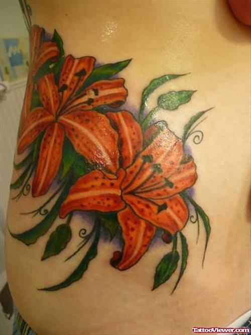 Attractive Lily Flowers Tattoo