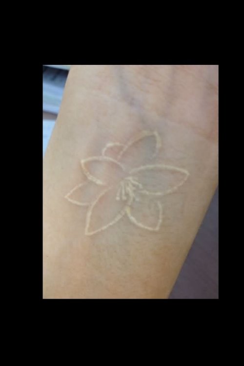 White Ink Lily Flower Tattoo