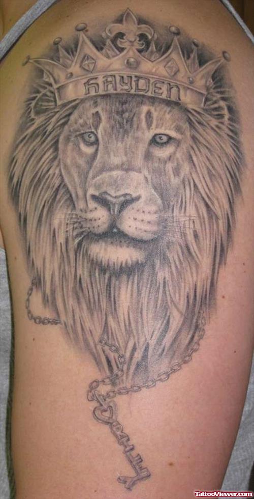 Grey Ink Crown Lion Tattoo On Left Shoulder