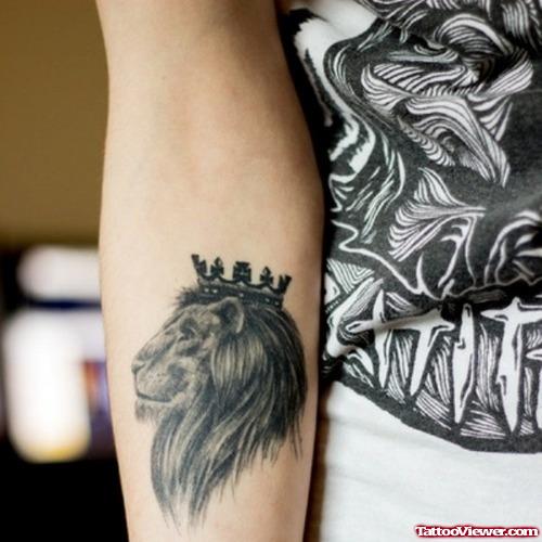 Grey Ink Crown Lion Tattoo On Arm
