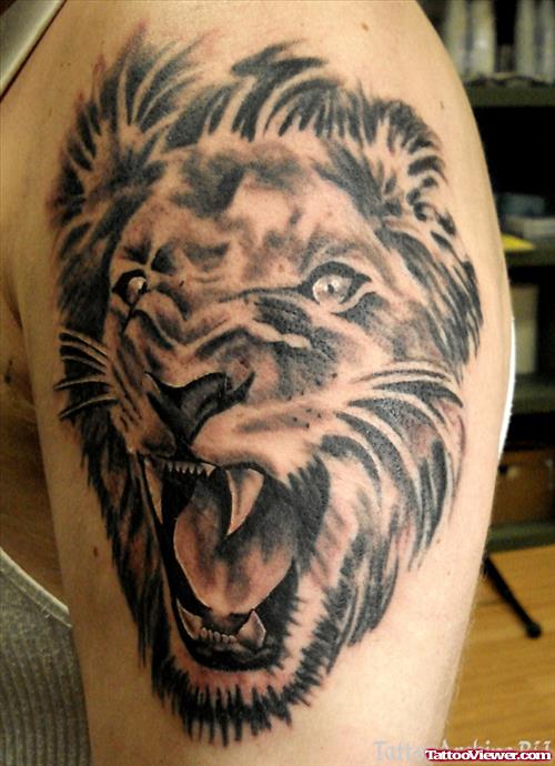 Grey Ink Roaring Lion Head Tattoo On Left Shoulder