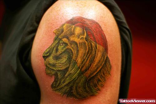 Green Ink Lion Head Tattoo On Shoulder