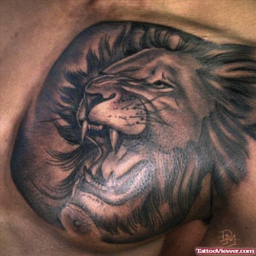 Dark Ink Lion Head Tattoo On Man Chest