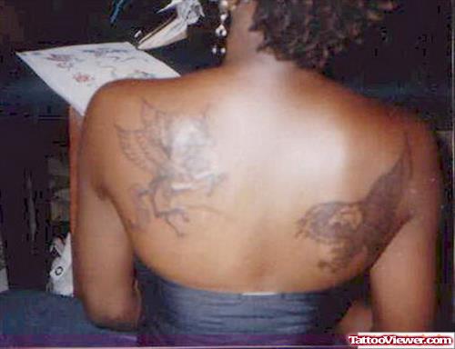 Unicorn And Lion Tattoo On Back Body