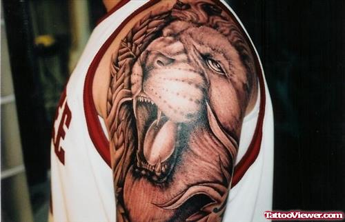 Awesome Grey Ink Lion Tattoo On Shoulder