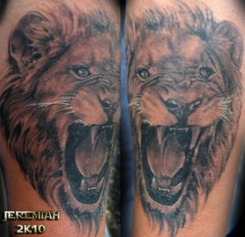 Roaring Lion Tattoo On Biceps