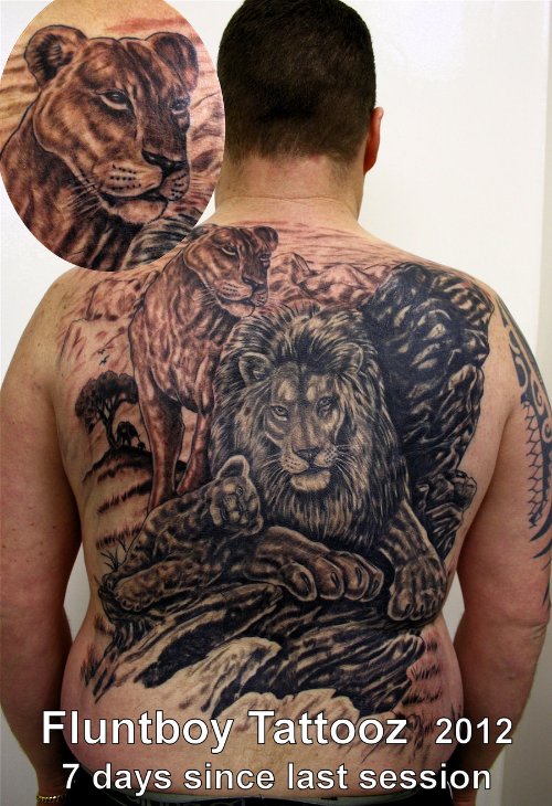 Grey Ink Lion Tattoo On Back Body