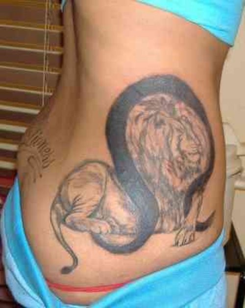 Big Lion Sitting Tattoo On Rib