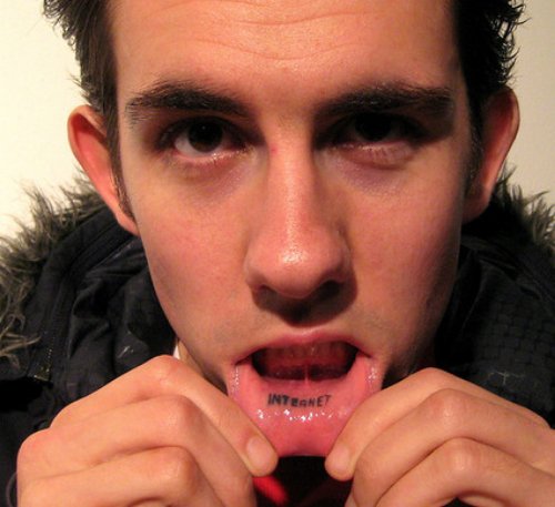 Guy Showing His Internet Lip Tattoo