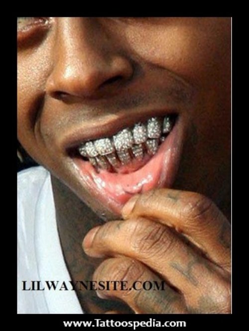 Lil Wayne Smiley Inner Lip Tattoo