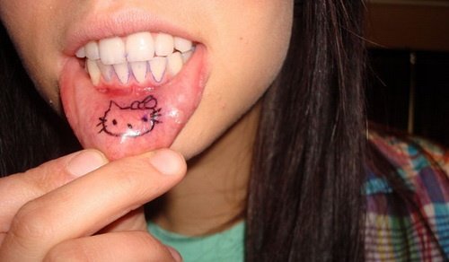 Kitty Lower Lip Tattoo