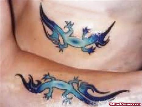 Matching Blue And Tribal Lizard Tattoos