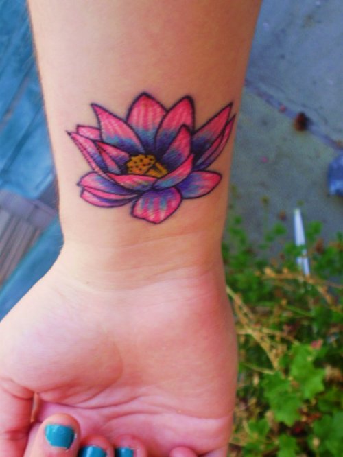 Cool Colored Lotus Tattoo On Right Wrist