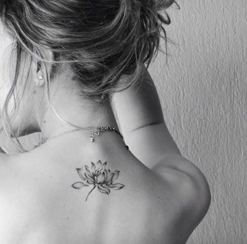 Simple Lotus Tattoo On Girls back