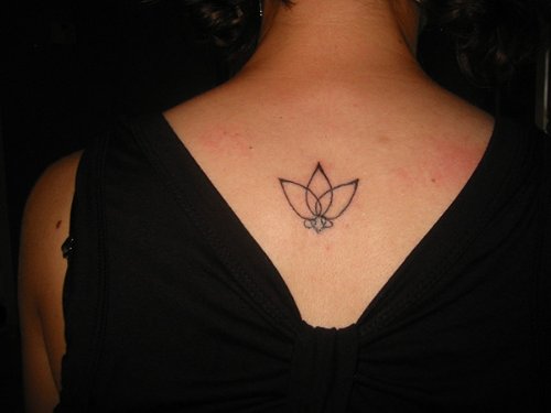 Small Lotus Tattoo On Girl Upperback