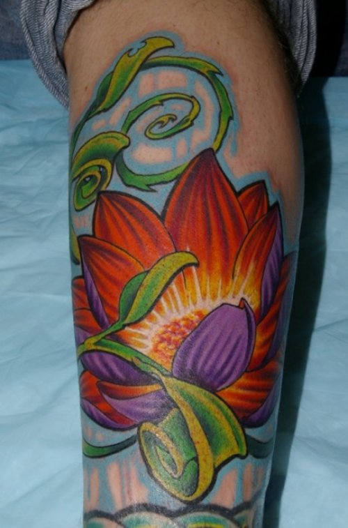 Awesome Colored Lotus Tattoo On Arm