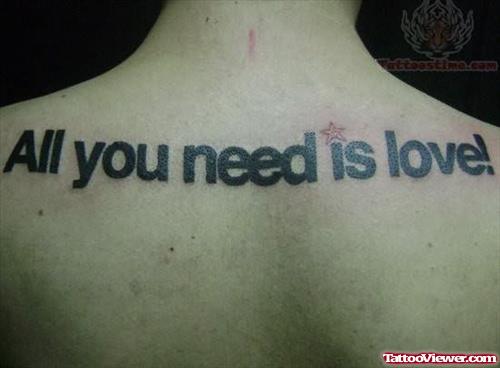 Love Is A Need Tattoo On Back
