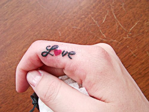 Love Tattoo On Right Finger