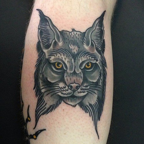 Yellow Eyes Black Ink Lynx Head Tattoo
