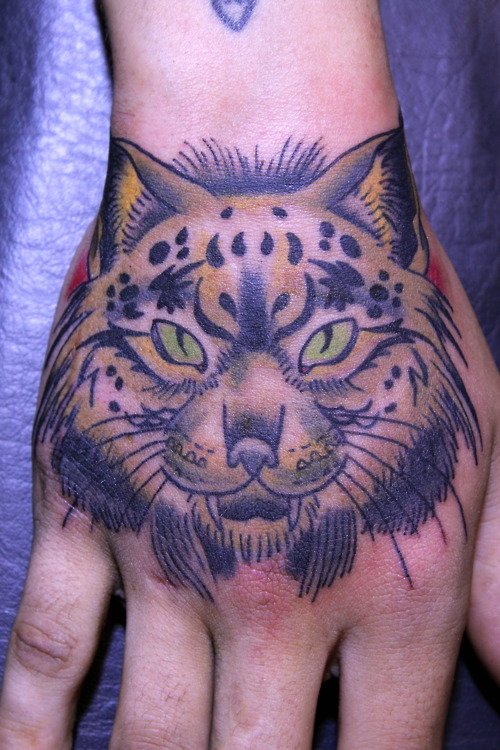 Lynx Face Color Ink Tattoo On Hand