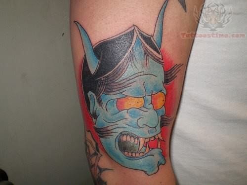 Blue Devil Face Tattoo on Arm