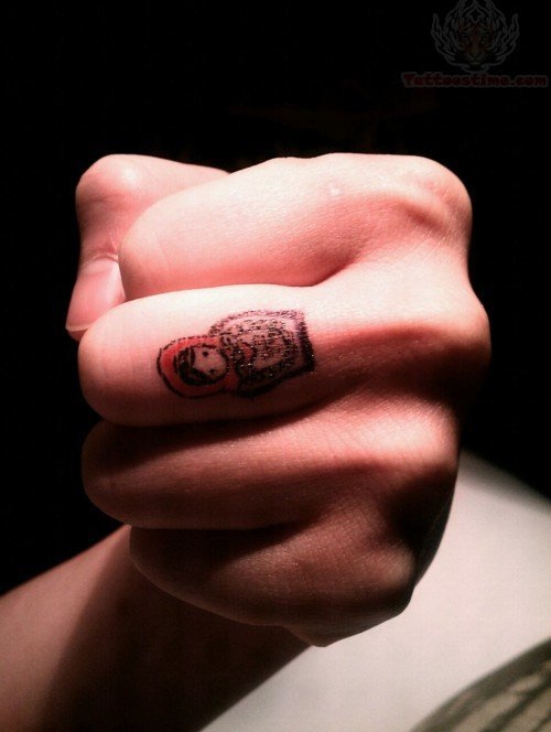 Matryoshka Tattoo On Finger
